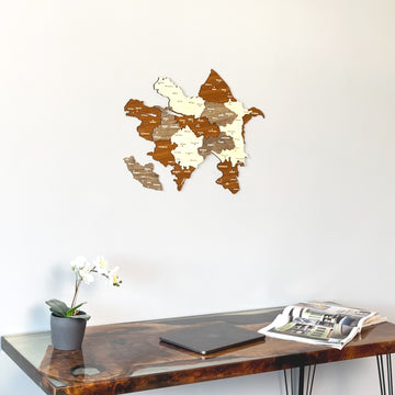 Azerbaijan wooden wall map close above the edge of a resin desk with an open magazine