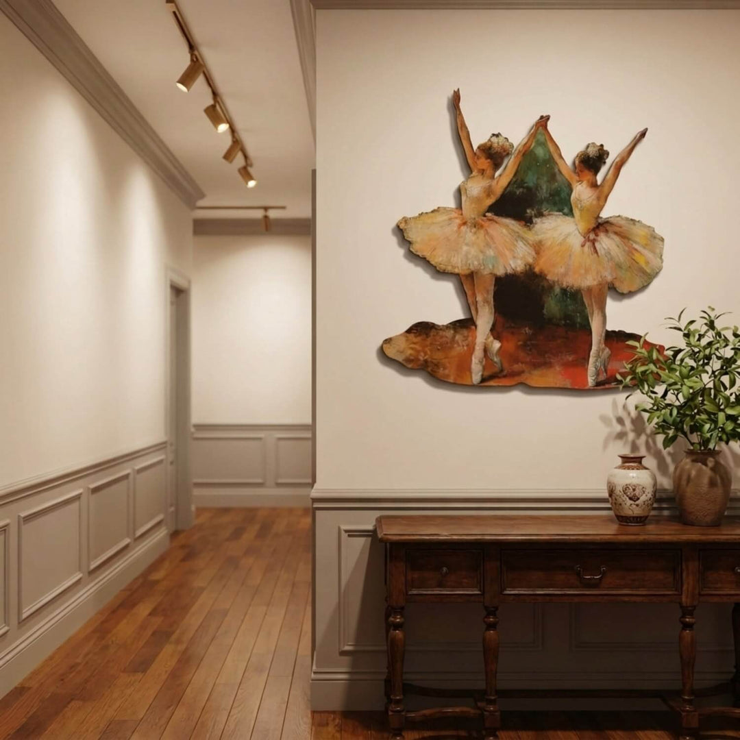 Ballerinas metal wall art in a hallway with wooden floor, above a console