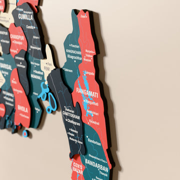 Close-up of the Flag colored Bangladesh wooden wall map with layered regions and printed names