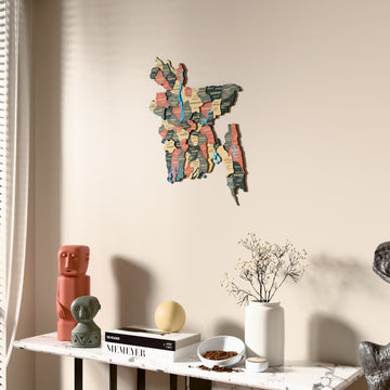 Sage Bangladesh wooden wall map beside a sheer curtain, angled view