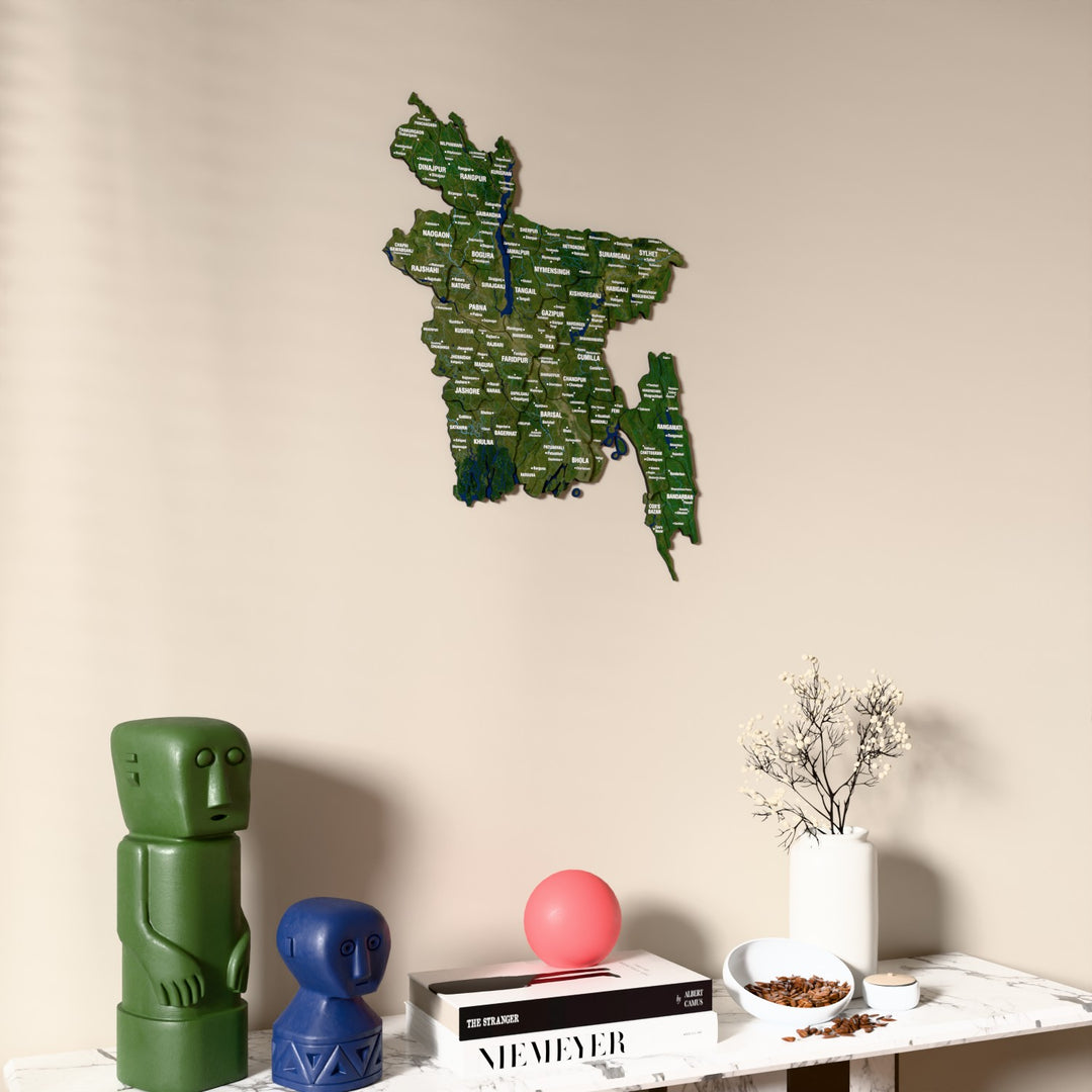 Satellite Bangladesh wooden wall map on a beige wall above a console with figurines
