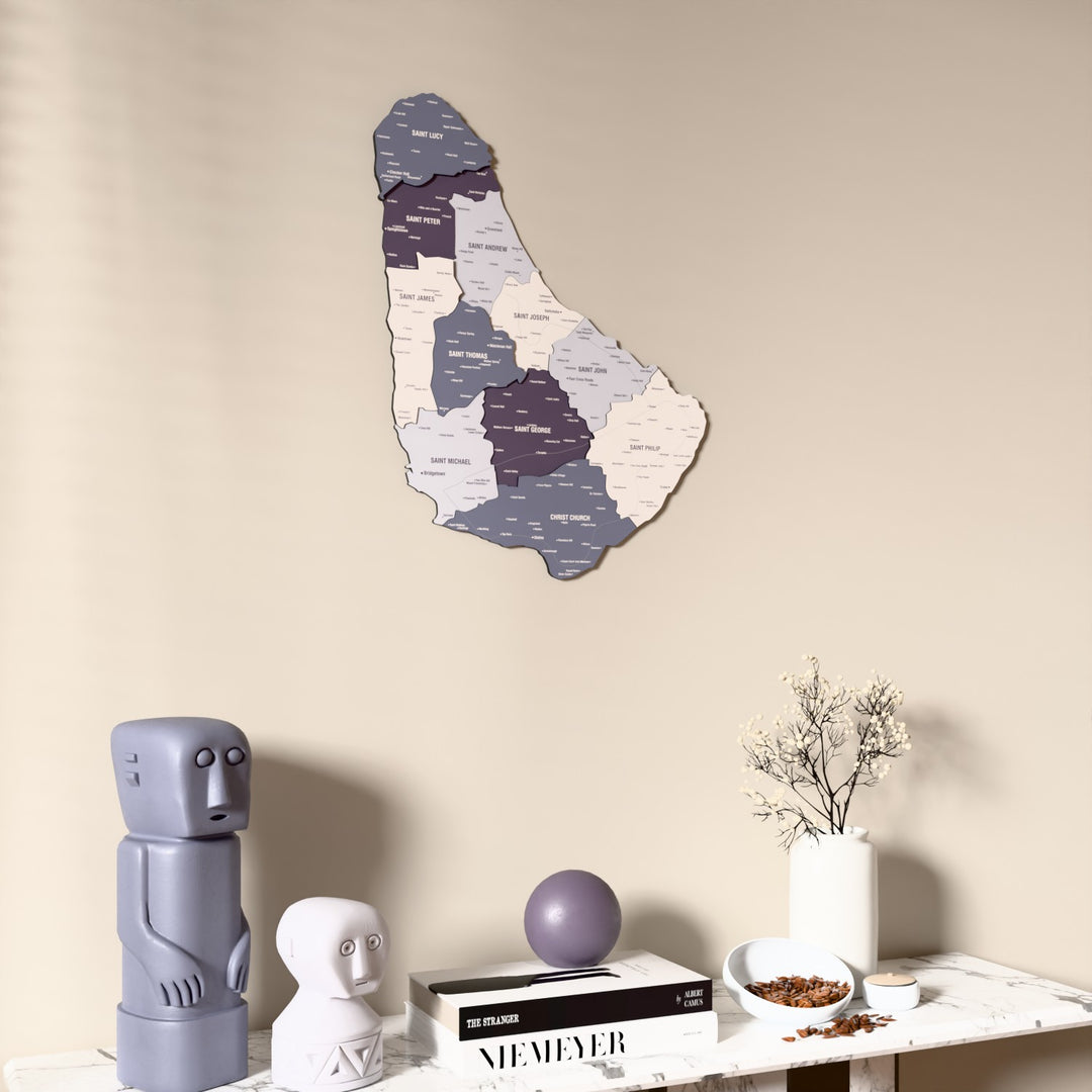Nimbus Barbados wooden wall map on a beige wall above a console with figurines