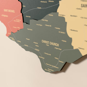 Close-up of the Sage Barbados wooden wall map with layered regions and printed names