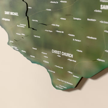 Close-up of the Satellite Barbados wooden wall map with layered regions and printed names