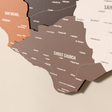 Close-up of the Soil Barbados wooden wall map with layered regions and printed names