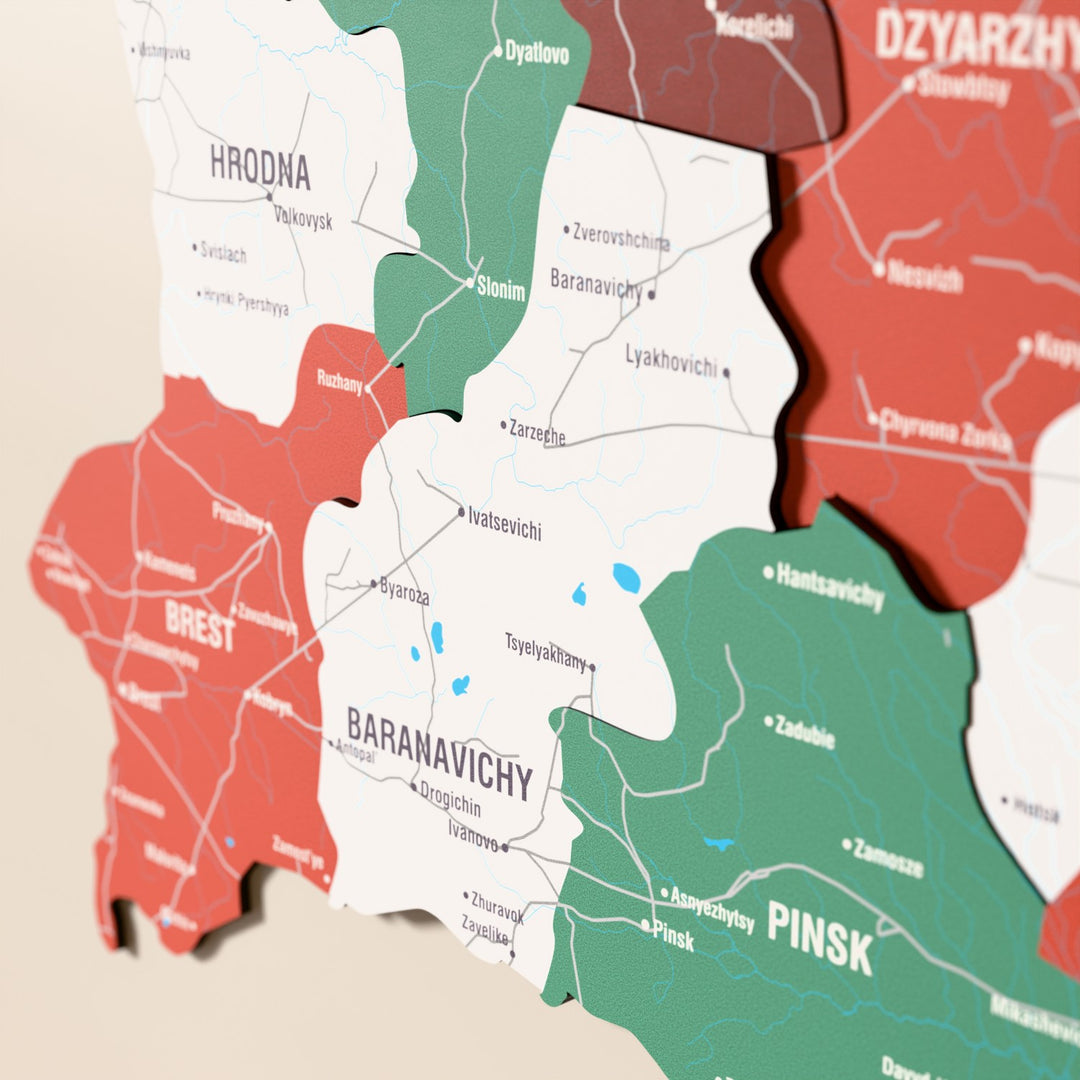 Close-up of the Flag colored Belarus wooden wall map with layered regions and printed names