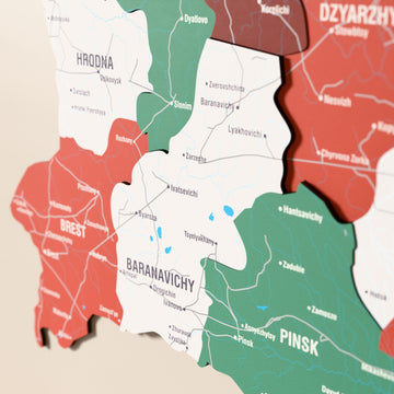 Close-up of the Flag colored Belarus wooden wall map with layered regions and printed names