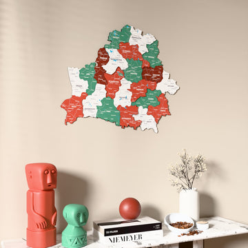 Flag colored Belarus wooden wall map on a beige wall above a console with figurines
