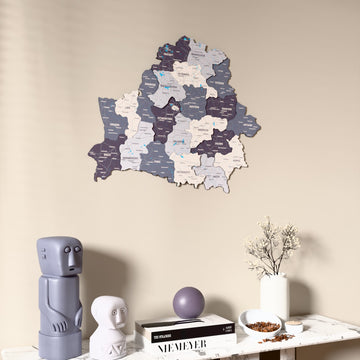 Nimbus Belarus wooden wall map on a beige wall above a console with figurines