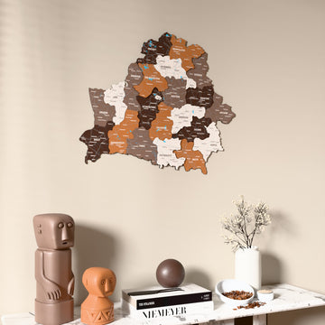 Soil Belarus wooden wall map on a beige wall above a console with figurines