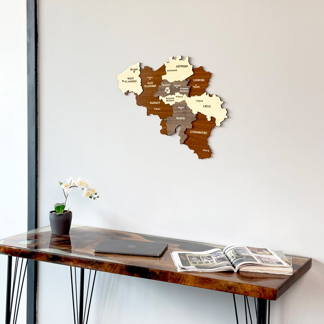 Belgium wooden wall map close view above a resin-topped desk