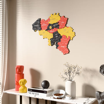 Flag colored Belgium wooden wall map beside a sheer curtain, angled view