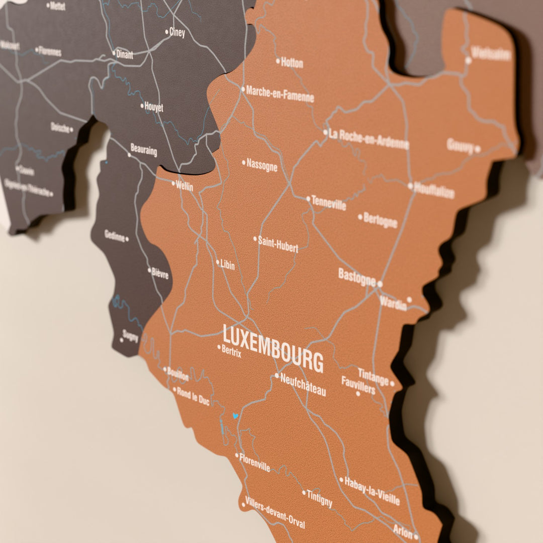 Close-up of the Soil Belgium wooden wall map with layered regions and printed names