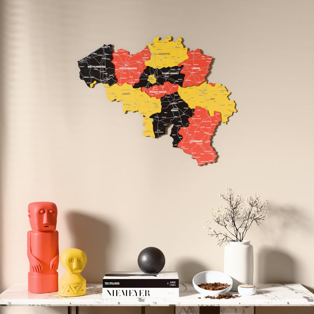 Flag colored Belgium wooden wall map above a marble console, front view
