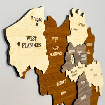Angled close-up of the wooden Belgium map showing West Flanders, East Flanders, Hainaut and Namur layers