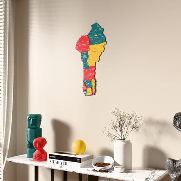 Flag colored Benin wooden wall map beside a sheer curtain, angled view