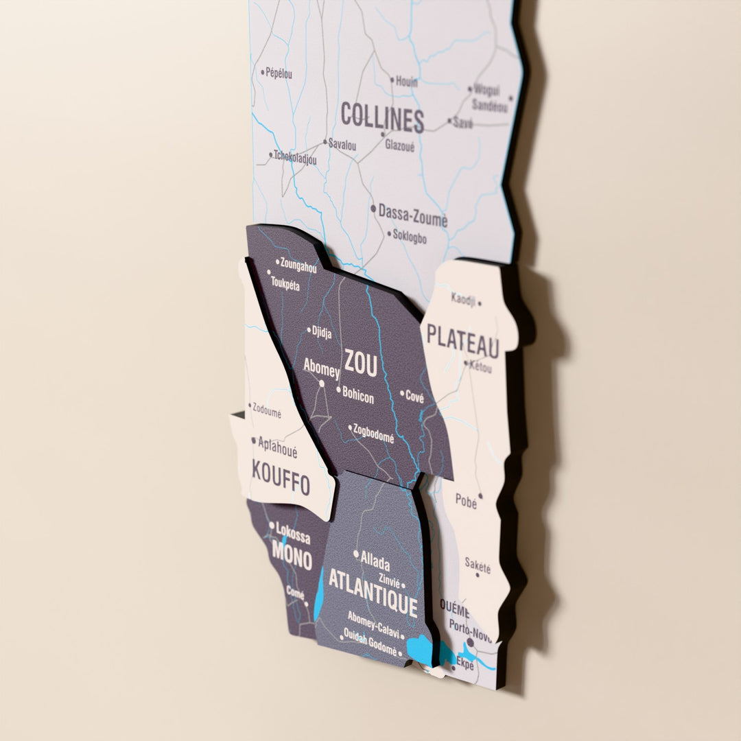 Close-up of the Nimbus Benin wooden wall map with layered regions and printed names