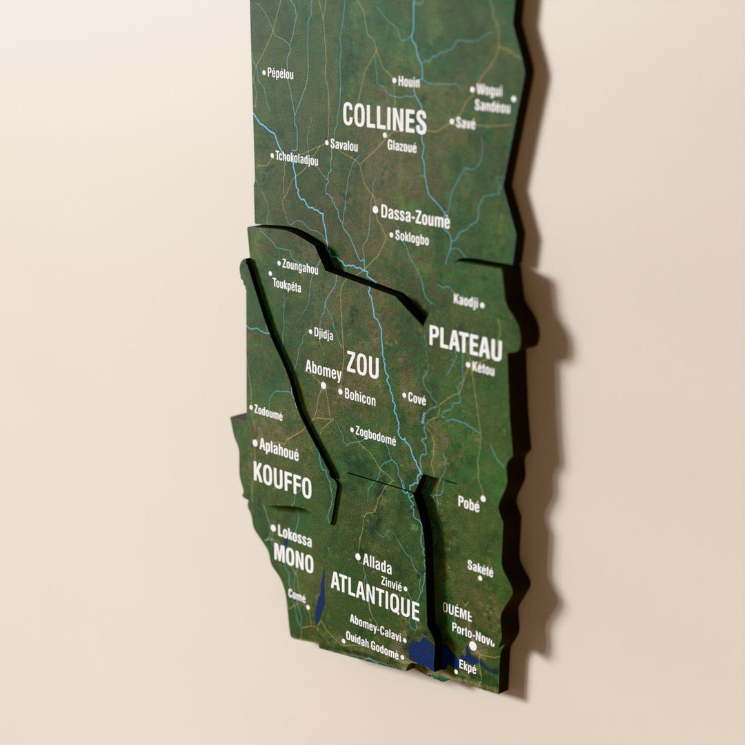 Close-up of the Satellite Benin wooden wall map with layered regions and printed names