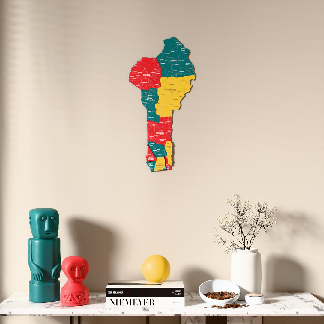 Flag colored Benin wooden wall map above a marble console, front view