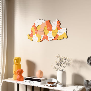 Flag colored Bhutan wooden wall map beside a sheer curtain, angled view