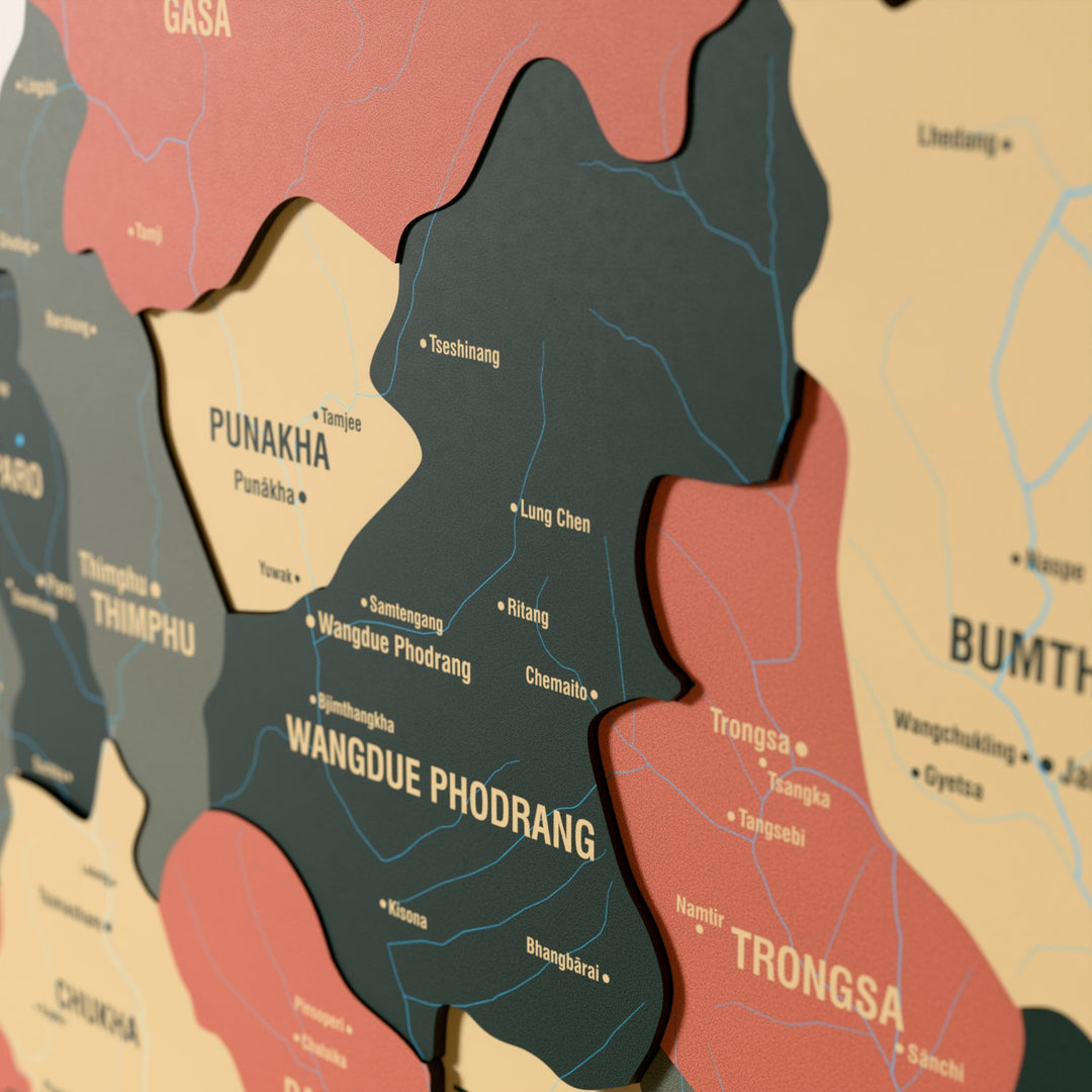 Close-up of the Sage Bhutan wooden wall map with layered regions and printed names