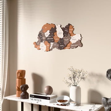 Soil Bhutan wooden wall map beside a sheer curtain, angled view