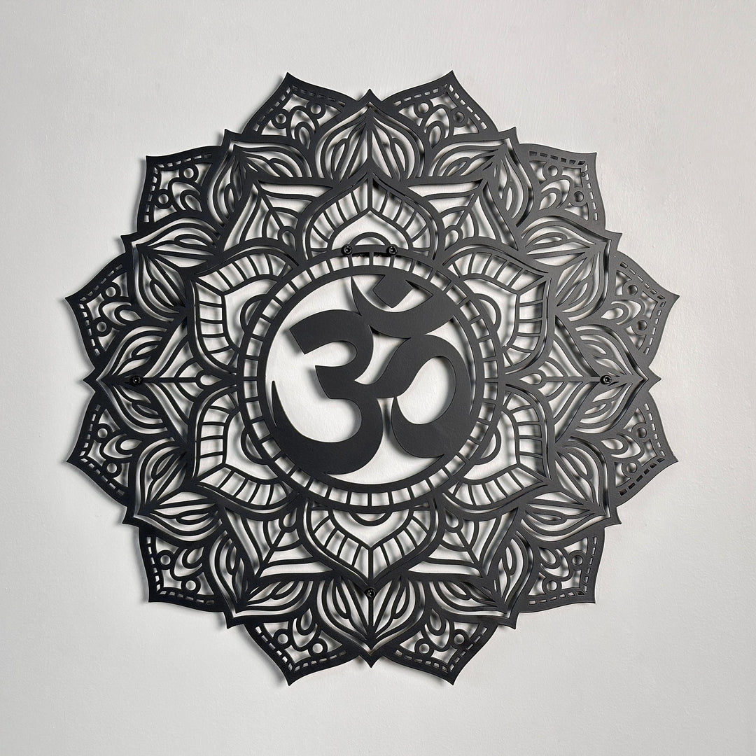 Black OM mandala metal wall art with a lotus-petal cutout pattern around a raised OM symbol