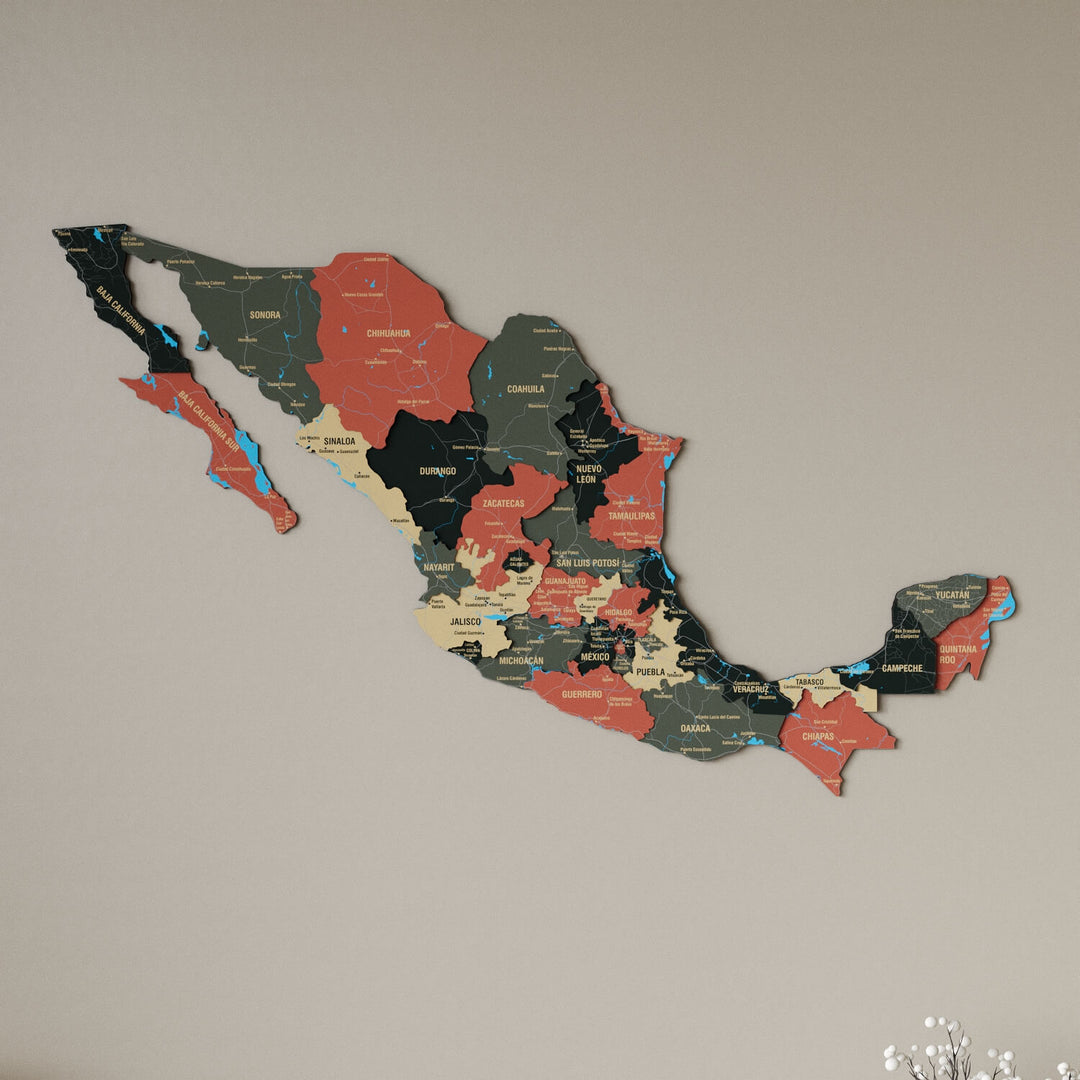 Sage Mexico wooden wall map in dark green, tan and salmon states on a beige wall, angled view showing the layered pieces