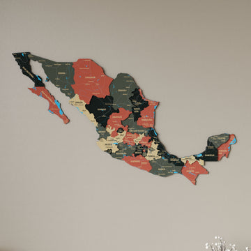 Sage Mexico wooden wall map in dark green, tan and salmon states on a beige wall, angled view showing the layered pieces