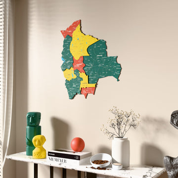 Flag colored Bolivia wooden wall map beside a sheer curtain, angled view
