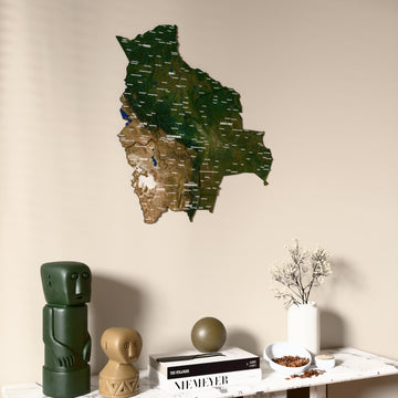 Satellite Bolivia wooden wall map on a beige wall above a console with figurines