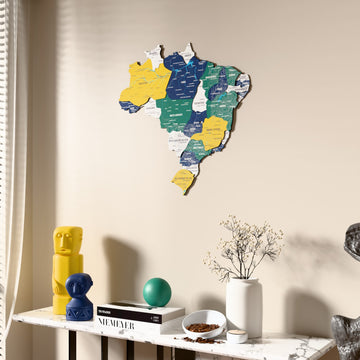 Flag colored Brazil wooden wall map beside a sheer curtain, angled view