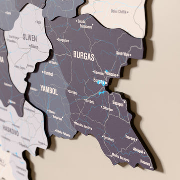 Close-up of the Nimbus Bulgaria wooden wall map with layered regions and printed names