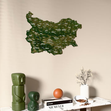 Satellite Bulgaria wooden wall map on a beige wall above a console with figurines