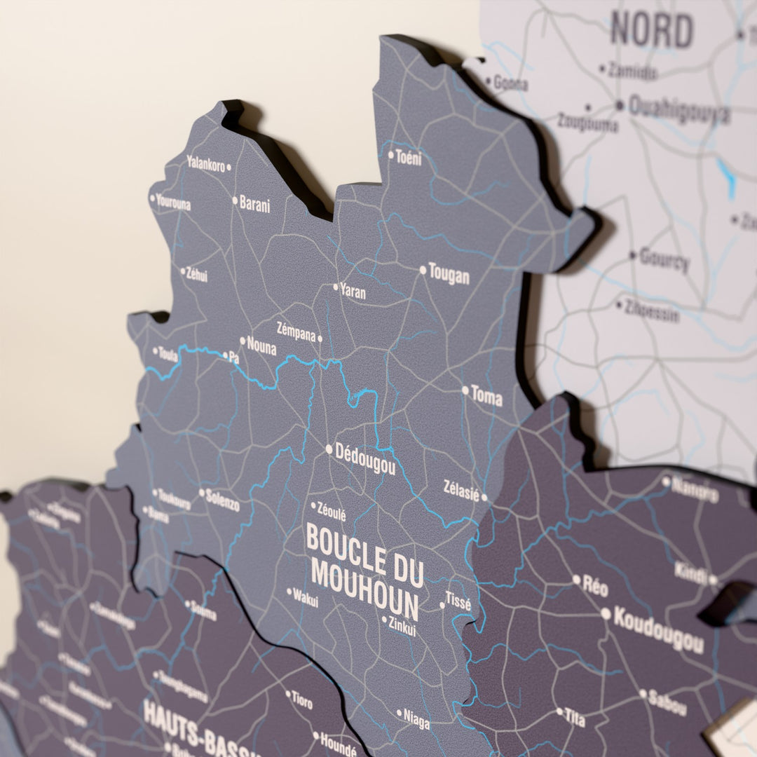 Close-up of the Nimbus Burkina Faso wooden wall map with layered regions and printed names