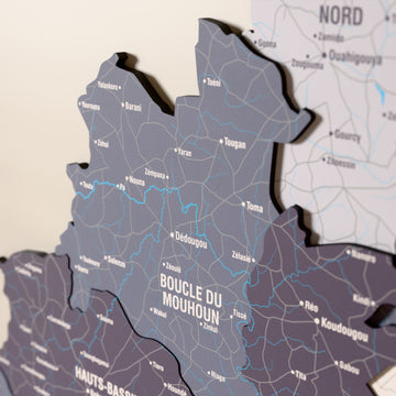 Close-up of the Nimbus Burkina Faso wooden wall map with layered regions and printed names