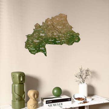 Satellite Burkina Faso wooden wall map on a beige wall above a console with figurines