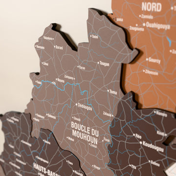 Close-up of the Soil Burkina Faso wooden wall map with layered regions and printed names