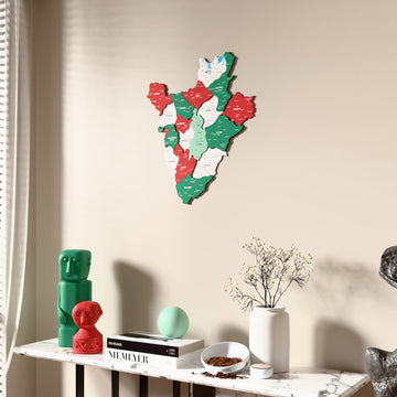 Flag colored Burundi wooden wall map beside a sheer curtain, angled view