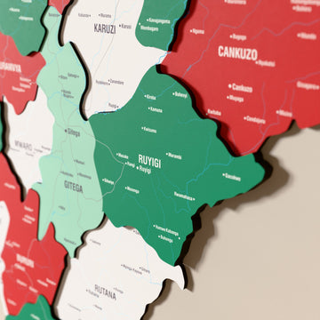 Close-up of the Flag colored Burundi wooden wall map with layered regions and printed names