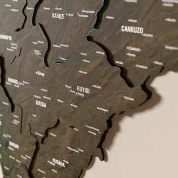 Close-up of the Satellite Burundi wooden wall map with layered regions and printed names