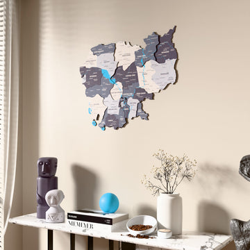 Nimbus Cambodia wooden wall map beside a sheer curtain, angled view