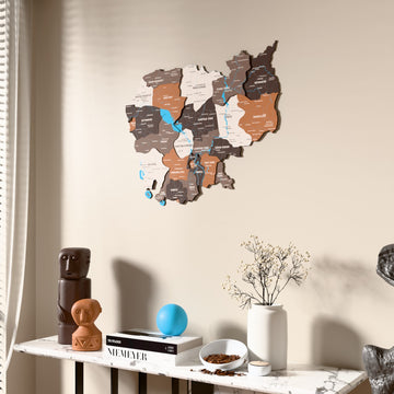 Soil Cambodia wooden wall map beside a sheer curtain, angled view