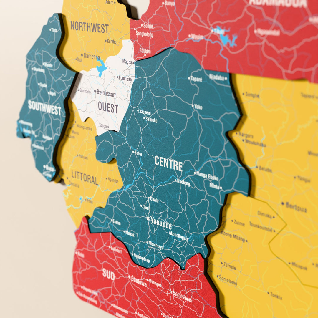 Close-up of the Flag colored Cameroon wooden wall map with layered regions and printed names