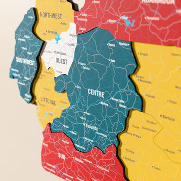 Close-up of the Flag colored Cameroon wooden wall map with layered regions and printed names