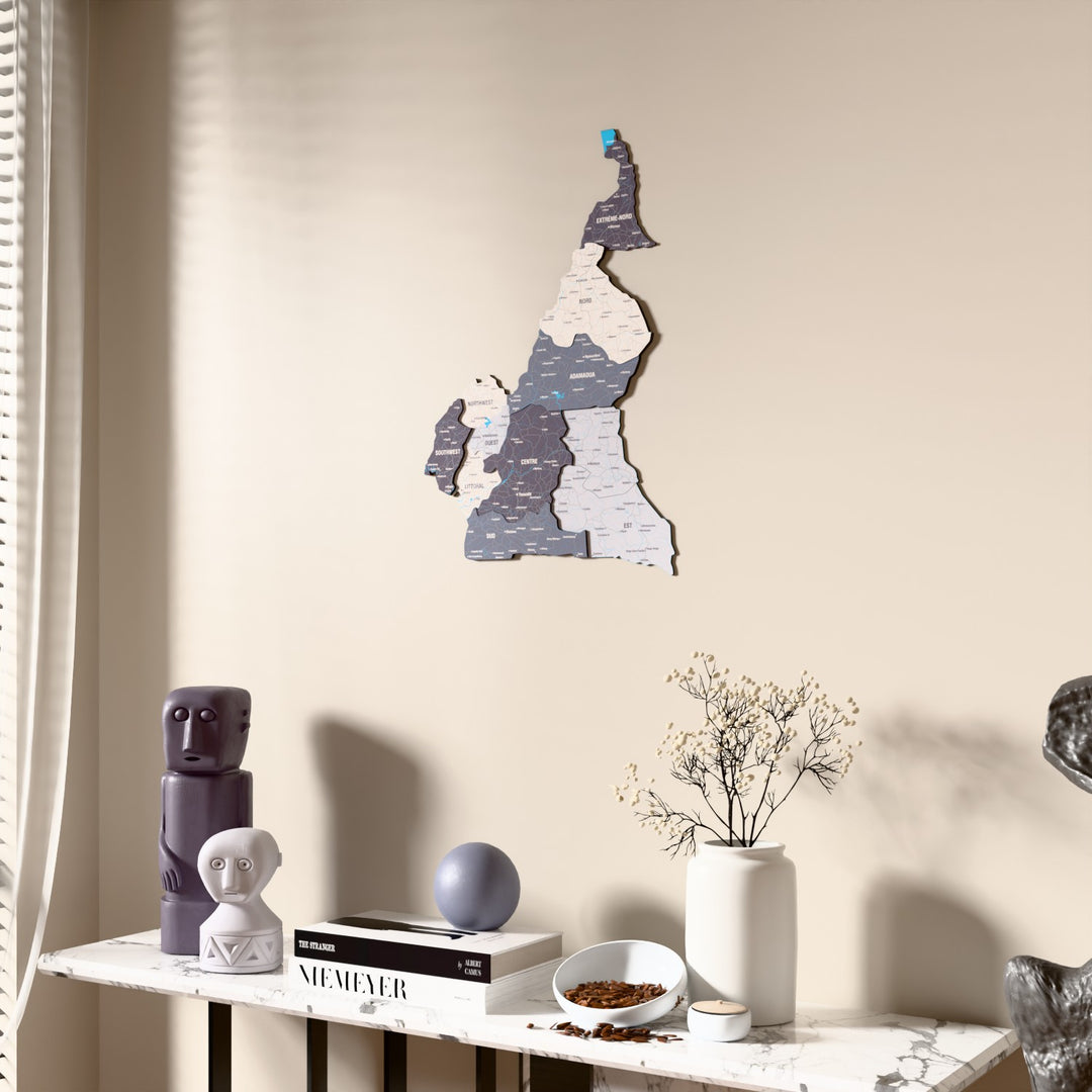 Nimbus Cameroon wooden wall map beside a sheer curtain, angled view