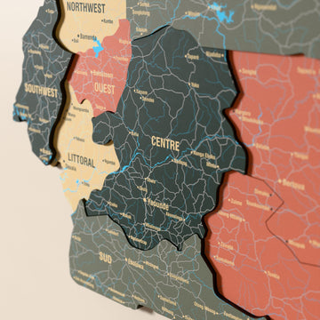 Close-up of the Sage Cameroon wooden wall map with layered regions and printed names