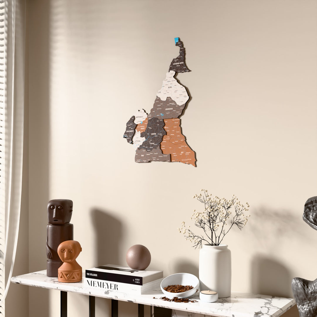 Soil Cameroon wooden wall map beside a sheer curtain, angled view