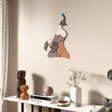 Soil Cameroon wooden wall map beside a sheer curtain, angled view