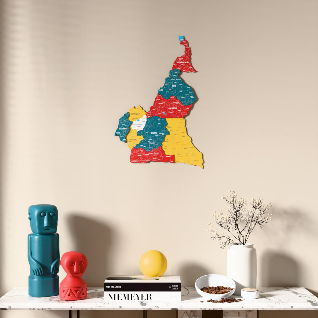 Flag colored Cameroon wooden wall map above a marble console, front view
